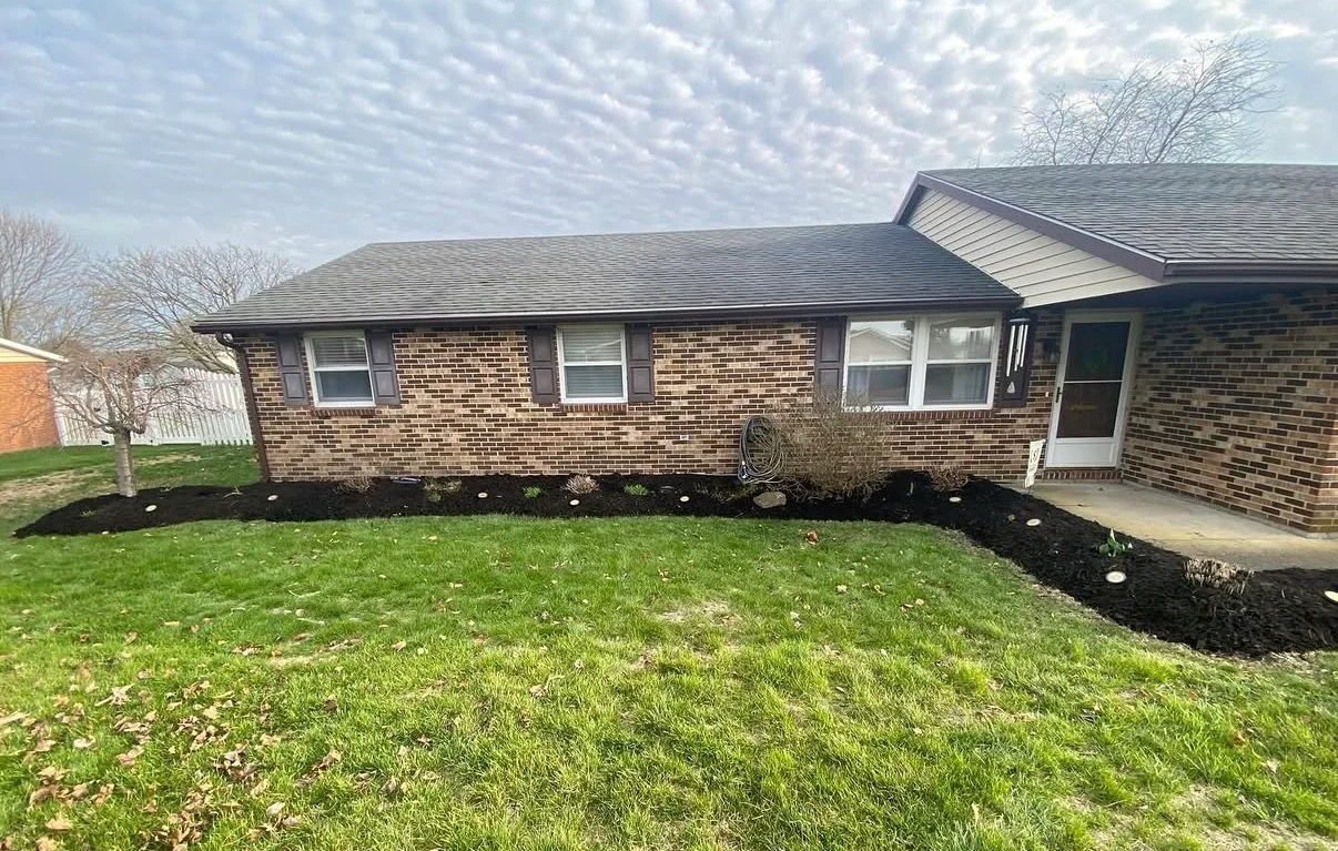 Manicured lawn with striped mowing pattern